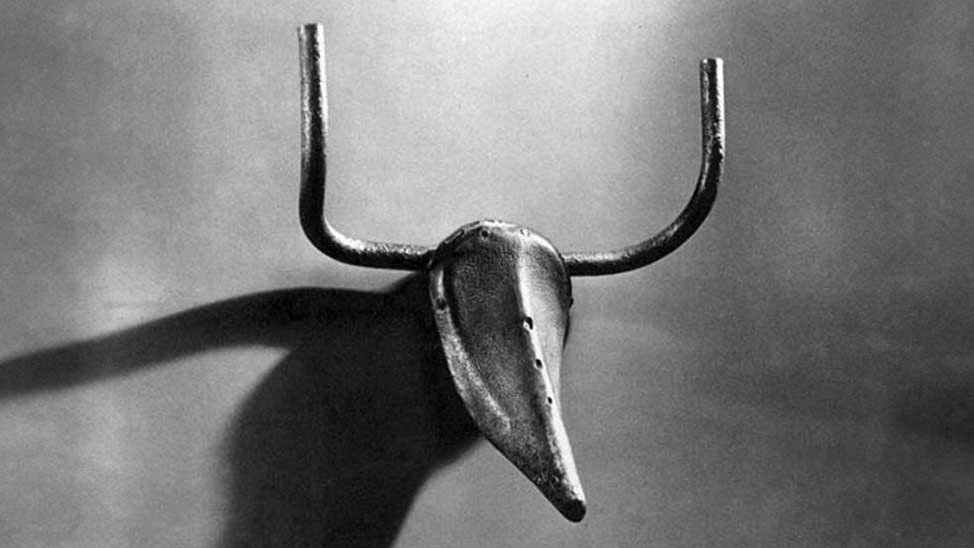 Photo of Pablo Picasso's Bull's Head, 1942. A bicycle seat and handlebars are combined to form a bull's head.